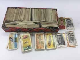 A collection of cigarette cards and collectors cards including Famous Footballers, Race Into