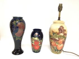 A collection of Moorcroft with designs of fruit an