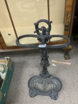 A vintage cast iron stick stand. (D)