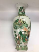 A famille vert vase of baluster form, six character mark to base, approx height 46cm. Shipping