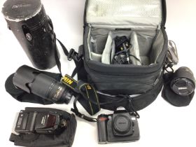 A Nikon D70 DSLR camera with Nikon AFS 18-70 DX le