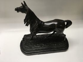 A bronze model of a horse, Approx 30cm x 33cm.