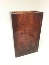 A large amber coloured rectangular vase, approx height 41cm. Shipping category D. NO RESERVE