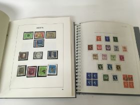 A box containing British and world stamps including an album of Swiss stamps other world stamps in