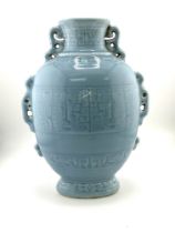 A light blue Chinese ceramic vase with pierced and