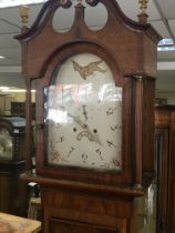 An inlaid oak and mahogany cross banded longcase clock eight day going with a white dial.