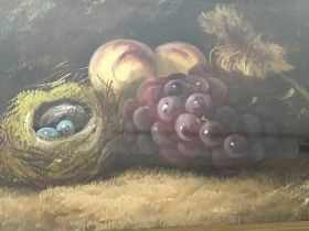 An Early 20th century oil painting still life study with fruit and a birds nest with eggs