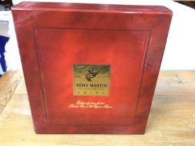 A boxed bottle of Remy Martin cognac. Opened. Postage D