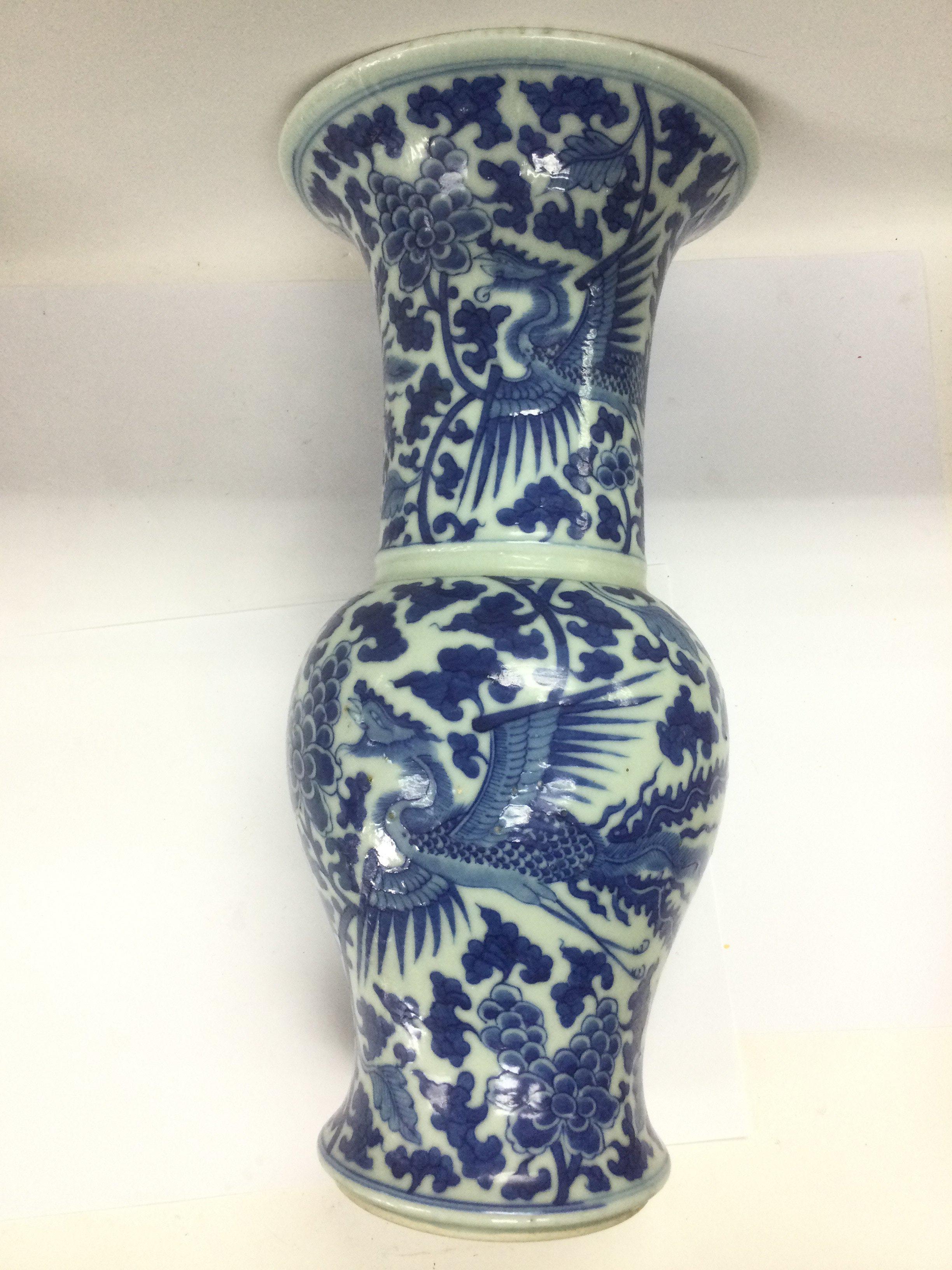 A blue and white Kangxi vase with a flared rim above a baluster body, approx height 46cm. Shipping