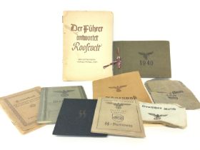 A collection of WW2 Third Reich documents, papers, ID cards, Ahnenpass (ancestral passport). The