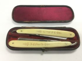 A rare cased pair of straight razors by George Wos