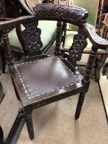 A Victorian carved corner chair on turned legs . NO RESERVE