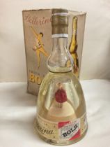 A boxed vintage bottle of Ballerina Erven Lucas Bols. Music box and wind up dancing ballerina seen