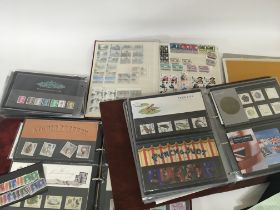 A collection of Royal Mail Presentation packs in two albums and others an album of unused British