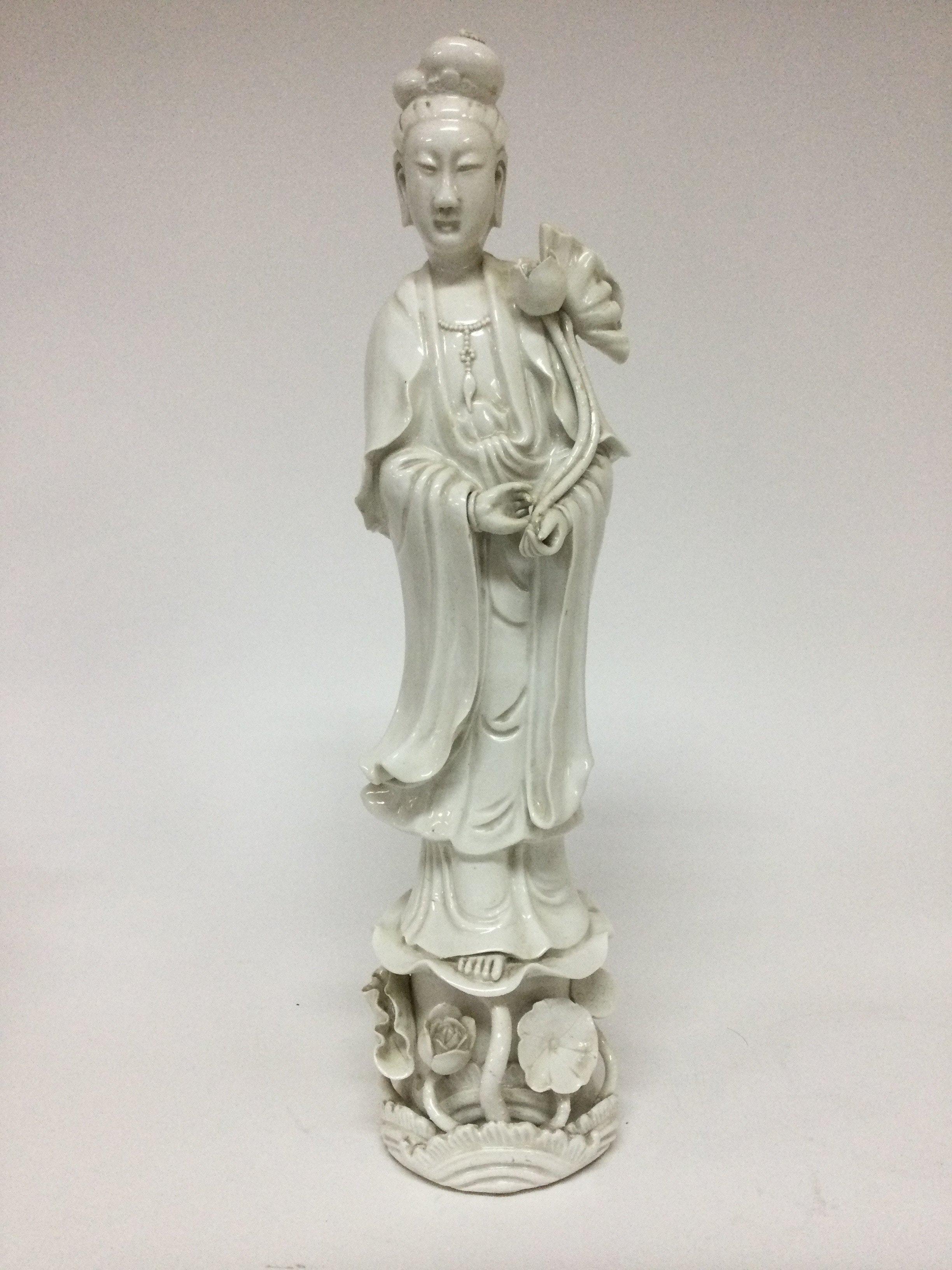 A Chinese white glazed figure Quan Yin 40 cm .