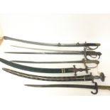 A collection of various reproduction swords including Sabres, Middle Eastern examples, a bayonet