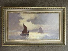 A framed Vic Ellis painting depicting sailing boats at sunset. Signed. Measuring 42cm x 22cm.