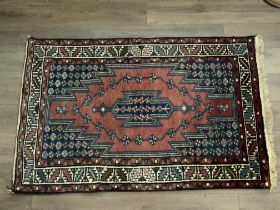 An Antique Persian rug. NO RESERVE