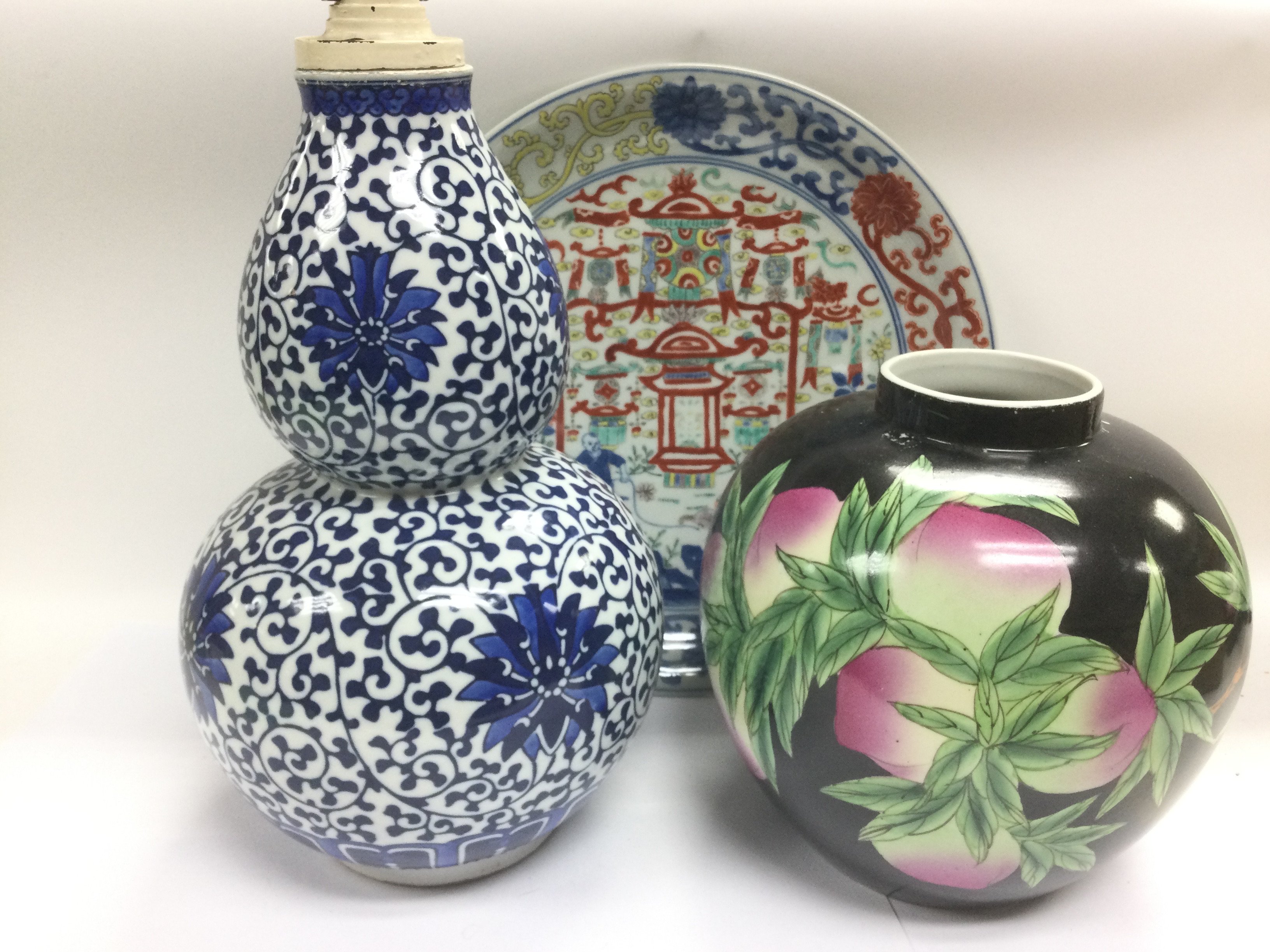 Three Chinese porcelain items comprising a blue and white double gourd vase converted in to a