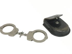 Vintage police handcuffs in original case with key