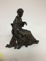 A Victorian bronze figure in the form a classical
