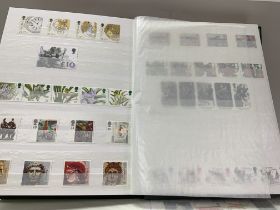 5 albums of British Mint postage stamps and presentation packs. (D)