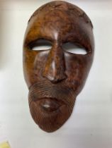 A burr wood tribal mask. NO RESERVE