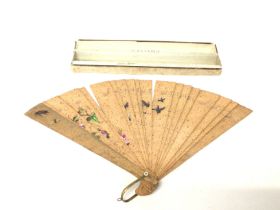 A Victorian Cork fan with box. Postage B