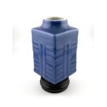 A small square from monochrome blue vase with turn