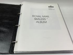 Royal Mail Smilers Album and 17 sheets of British stamps. (D)