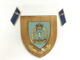 A Royal Observer Corps wooden plaque and a pair of epaulettes. Shipping category A.