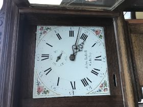 A oak long case clock the enamel painted dial with Roman numerals, John Rufsell , Coltefsey .