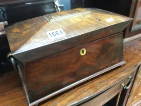 A Quality Mahogany tea caddy with a hinged top enclosing a fitted interior.