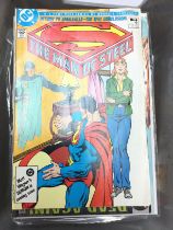 A box containing comics including DC superman and