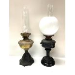 2 Victorian oil lamps, 1 cast iron and brass, 1 shelter with frosted white shade.