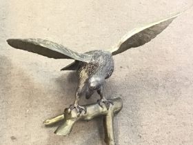 A large bronze eagle model. 64cm wide by 50cm high. Postage D