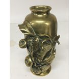 A Japanese late 19th Century brass vase with raised frog and foliage decoration height 17cm. NO