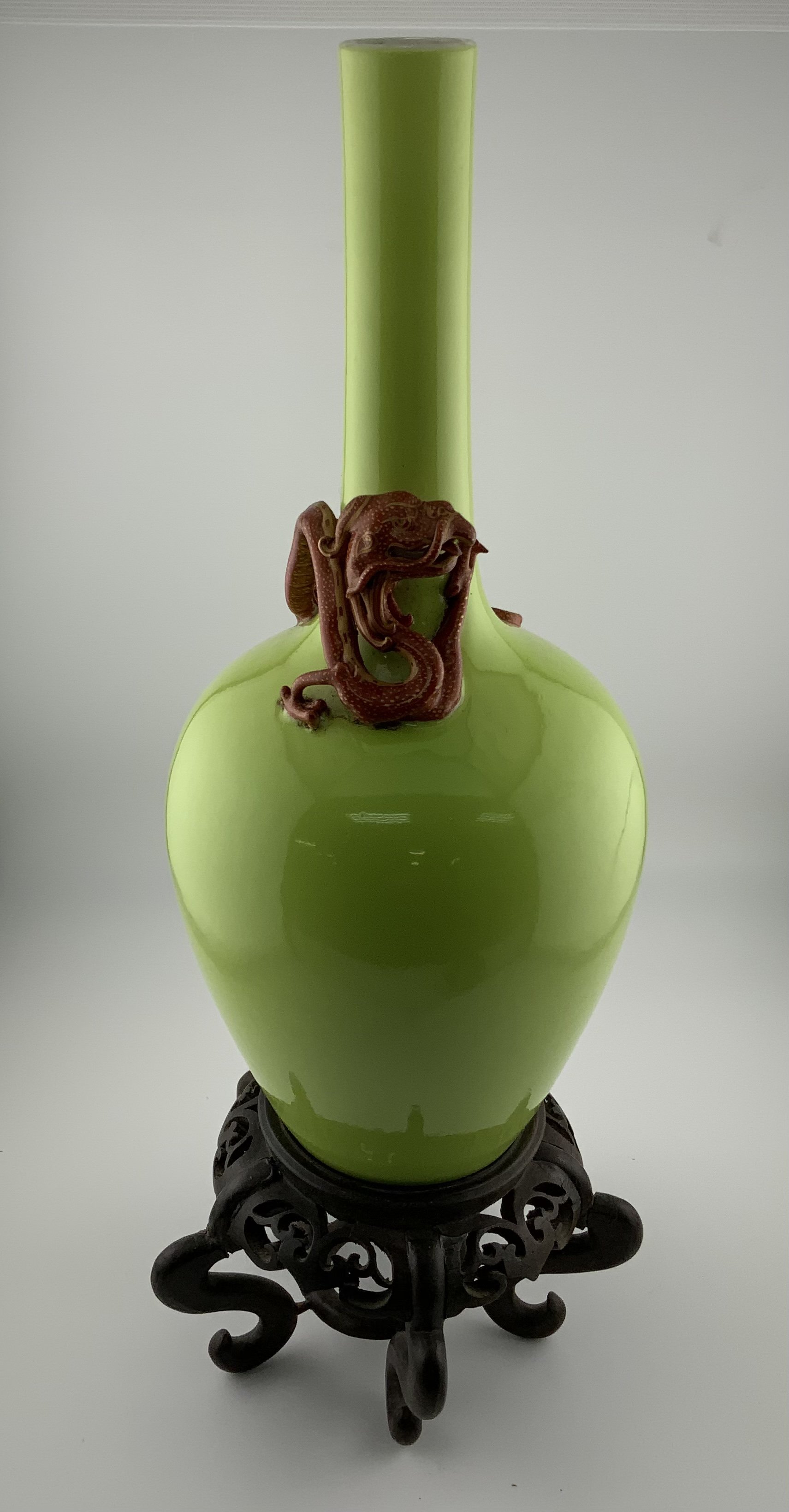 A Chinese Apple green glazed monochrome bottle vas