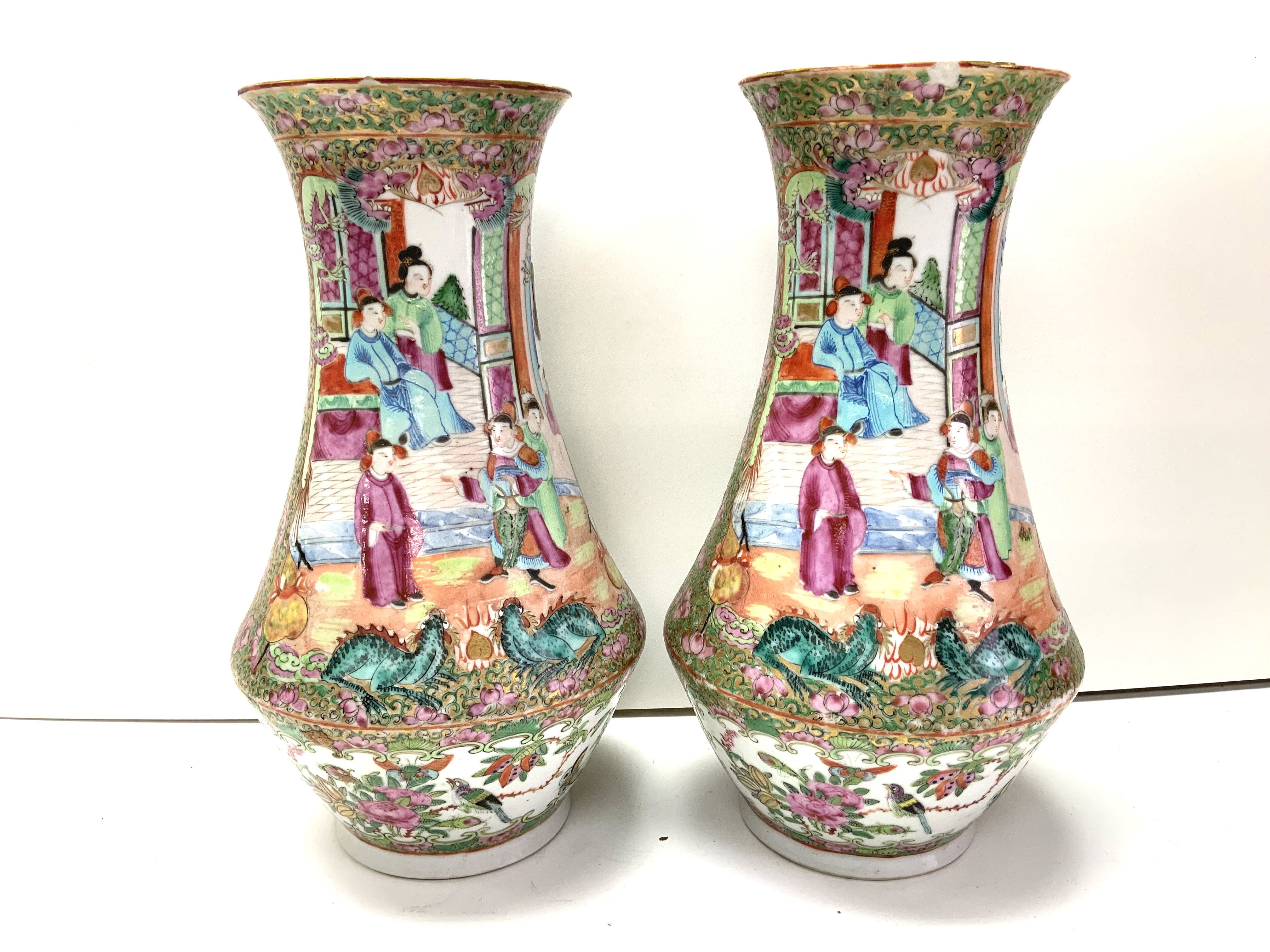 A pair of Cantonese porcelain baluster shaped vases. 25cm (D) some damage to rim. - Image 2 of 3