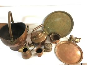 A collection of assorted copper and others items including a kettle and coal scuttle. Postage C.