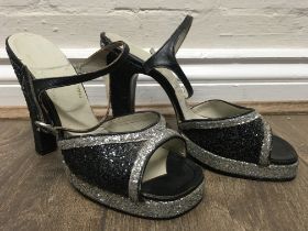 A vintage pair of Terry de Havilland platform shoes decorated with black and silver glitter