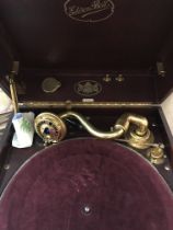 A Edison Bell Electron table top gramophone fitted in a red case .