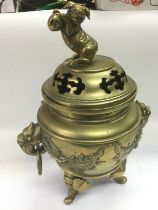 A large brass koro with applied dragon decoration and surmounted with a Fo dog, approx height