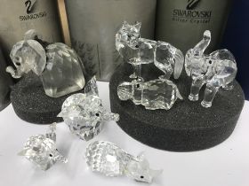 Seven Swarovski African animals including Wolf, four various size elephants, a Rhinoceros and a