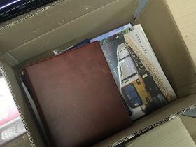 A box containing cigarette card albums train and bus books and other oddments. NO RESERVE