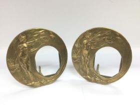 A pair of circular brass photo frames of Art Nouveau style, approx height 16cm.