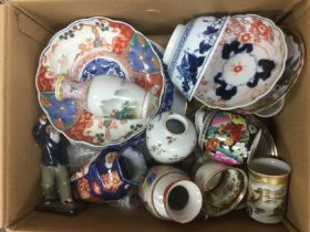 A box of mixed Oriental ceramics comprising vases, plates, cups etc.