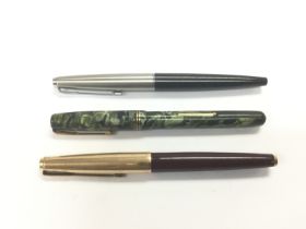 Three vintage fountain pens comprising two Parker