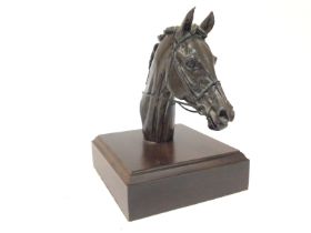 A Harriet Glen small bronze horse bust. Overall size 14cm wide and 19cm high.