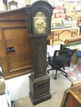An Oak Grandmother clock with a brass dial, 160cm tall. Postage category D. NO RESERVE